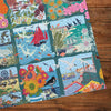 Coastal Calling 1000 Piece Jigsaw Puzzle by Gibsons made up on wooden table