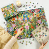 Jungle dream 1000 piece white logo jigsaw puzzle by Gibsons on the table